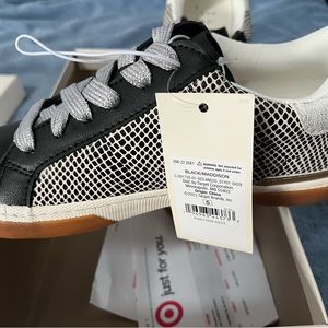 Women’s fashion sneakers.   Black and white with silver laces.   Size 5